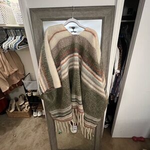 Over the shoulder throw. Shawl. Green, tan and burnt orange. Tassels and fuzzy.